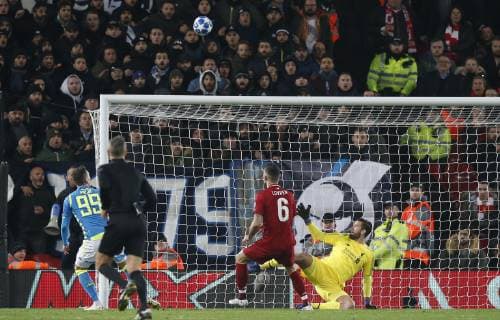 Alisson Becker of Liverpool makes a last minute save from Arkadiusz Milik of Napoli during the UEFA Champions League Group C match at Anfield Stadium, Liverpool. Picture date 11th December 2018. Picture credit should read: Andrew Yates Sportimage EDITORIAL USE ONLY. No use with unauthorised audio, video, data, fixture lists, club league logos or live services. Online in-match use limited to 120 images, no video emulation. No use in betting, games or single club league player publications. SPI_067_AY_Liverpool_Napoli.jpg