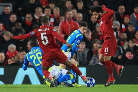 11th December 2018, Anfield, Liverpool, England; UEFA Champions League football, Liverpool versus Napoli; Kalidou Koulibaly of Napoli tackles Georginio Wijnaldum of Liverpool  ActionPlus12086857 DavidxBlunsden