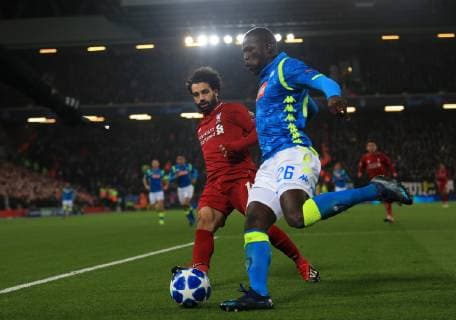 11th December 2018, Anfield, Liverpool, England; UEFA Champions League football, Liverpool versus Napoli; Kalidou Koulibaly of Napoli shields the ball from Mohamed Salah of Liverpool  ActionPlus12086860 DavidxBlunsden
