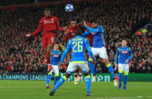 11th December 2018, Anfield, Liverpool, England; UEFA Champions League football, Liverpool versus Napoli; Georginio Wijnaldum of Liverpool leaps above the Napoli defence to head at goal  ActionPlus12086866 DavidxBlunsden