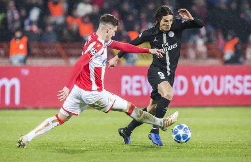 11th December 2018, Rajko Mitic Stadium, Belgrade, Serbia; UEFA Champions League football, Red Star Belgrade versus Paris Saint-Germain; Edinson Cavani of Paris Saint-Germain challenges Milos Degenek of Red Star Belgrade  ActionPlus12086915 NikolaxKrstic