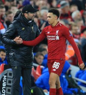 11th December 2018, Anfield, Liverpool, England; UEFA Champions League football, Liverpool versus Napoli; Liverpool manager Jurgen Klopp gives instructions to Trent Alexander-Arnold of Liverpool  ActionPlus12086937 DavidxBlunsden