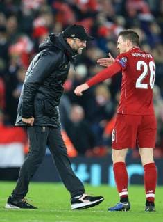 11th December 2018, Anfield, Liverpool, England; UEFA Champions League football, Liverpool versus Napoli; Liverpool manager Jurgen Klopp congratulates Andrew Robertson of Liverpool after the final whistle  ActionPlus12086940 DavidxBlunsden