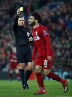 Football - 2018 2019 UEFA Champions League - Group C: Liverpool vs. Napoli Mohamed Salah of Liverpool is booked referee Damir Skomina at Anfield. COLORSPORT LYNNE CAMERON 