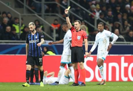 (181212) -- MILAN, Dec. 12, 2018 (Xinhua) -- FC Inter s Marcelo Brozovic (1st L) gets a yellow card during a Group B match of the UEFA Champions League between FC Inter and PSV Eindhoven in Milan, Italy, Dec. 11, 2018. The match ended with 1-1. (Xinhua Cheng Tingting) (SP)ITALY-MILAN-FOOTBALL-UEFA CHAMPIONS LEAGUE-INTER MILAN VS EINDHOVEN 