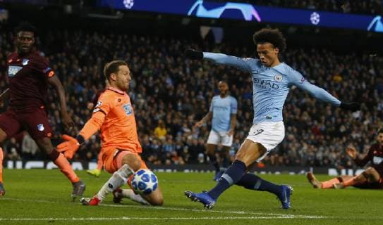 Leroy Sane of Manchester City scores their second goal past Oliver Baumann of Hoffenheim during the UEFA Champions League Group F match at the Etihad Stadium, Manchester. Picture date 12th December 2018. Picture credit should read: Simon Bellis Sportimage EDITORIAL USE ONLY. No use with unauthorised audio, video, data, fixture lists, club league logos or live services. Online in-match use limited to 120 images, no video emulation. No use in betting, games or single club league player publications.