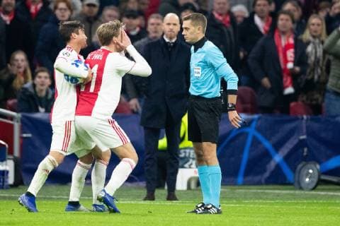 Nico Tagliafico of Ajax, Frenkie de Jong of Ajax, referee Clement Turpin during the UEFA Champions League group E match between Ajax Amsterdam and Bayern Munich at the Johan Cruijff Arena on December 12, 2018 in Amsterdam, The Netherlands UEFA Champions League 2018 2019 xVIxVIxImagesx xTomxBodexMultimediaxIVx 13055067