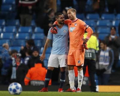 Ilkay Gundogan of Manchester City hugs Oliver Baumann of Hoffenheim during the UEFA Champions League Group F match at the Etihad Stadium, Manchester. Picture date 12th December 2018. Picture credit should read: Simon Bellis Sportimage EDITORIAL USE ONLY. No use with unauthorised audio, video, data, fixture lists, club league logos or live services. Online in-match use limited to 120 images, no video emulation. No use in betting, games or single club league player publications.