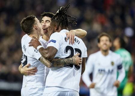 12th December 2018, Mestalla Stadium, Valencia, Spain; UEFA Champions League football, Valencia versus Manchester United ManU Batshuayi of Valencia CF celebrates with Santi Mina of Valencia CF and Carlos Soler of Valencia CF after the own goal from Phil Jones of Manchester United makes the score 2-0 for Valencia CF in minute 46  ActionPlus12087268 IvanxArlandis
