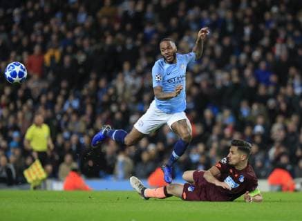 12th December 2018, Etihad Stadium, Manchester, England; UEFA Champions League football, Manchester City versus Hoffenheim; Raheem Sterling of Manchester City is tackled by Benjamin Hubner of Hoffenheim  ActionPlus12087274 ConorxMolloy