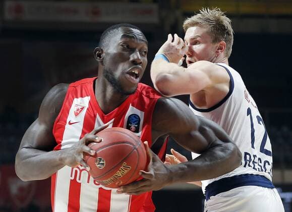 (181213) -- BELGRADE, Dec. 13, 2018 -- Crvena Zvezda s Michael Ojo (L) vies with Brescia s Eric Mika during the round 9 match at the regular season of 2018-2019 Eurocup basketball tournament between Crvena Zvezda and Brescia in Belgrade, Serbia on Dec. 12, 2018. Crvena Zvezda won 103-67. ) (SP)SERBIA-BELGRADE-BASKETBALL-EUROCUP-CRVENA ZVEZDA VS BRESCIA PredragxMilosavljevic 