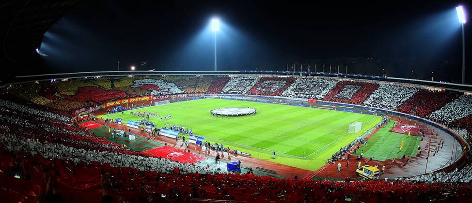 11.12.2018 Belgrade(Serbia) FK Crvena Zvezda(FC Red Star)-FC Paris Saint Germain PSG UEFA Champions League men s football. Nord tribune of Rajko Mitic stadium coreography of FC Red Star fans Deliye against PSG president and financier Nasser Al Khelaifi whom complained and protest to UEFA against FC Red Star.From cartoon film Bugs Bunny Camel-Palm trees-reddish Arabian and 1991 year( at east tribune) when FC Red Star was European champion. Down transparent Looking For Something . :Str 