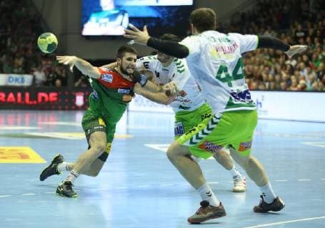19 12 2018 xcsx Handball DHB Cup SC Magdeburg Frisch Auf Goeppingen emspor v l Juan De La Pena SC Magdeburg held by Kresimir Kozina Frisch Auf Göppingen DFL DFB REGULATIONS PROHIBIT ANY USE OF PHOTOGRAPHS as IMAGE SEQUENCES and or QUASI VIDEO Magdeburg