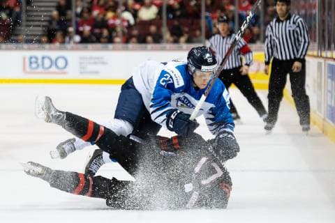 181223 Eeli Tolvanen of Finland tackles Nicholas Suzuki of Canada during the U20 ice hockey game between Finland and Canada on December 23 2018 in Vancouver Photo Joel Marklund BILDBYR u0081N kod JM 87821, detectedSourceLanguage  Copyright: JOELxMARKLUND BB181223JM003