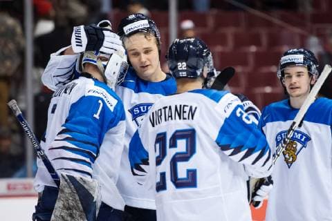 181223 Goaltender Ukko Pekka Luukkonen and Otto Latvala of Finland celebrate their teams win during the U20 ice hockey game between Finland and Canada on December 23 2018 in Vancouver Photo Joel Marklund BILDBYR u0081N kod JM 87821, detectedSourceLanguage  Copyright: JOELxMARKLUND BB181223JM025