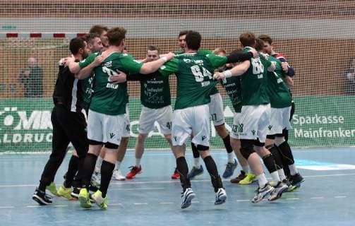 v left players of DJK Rimpar Wölfe celebrate the victory after the end of the game DKB 2 Handball Bundesliga DJK Rimpar Wölfe TuSEM Essen xfsx