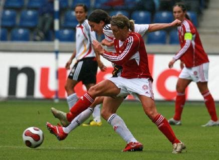 German Birgit Prinz behind and Danish Catherine Paaske Soerensen during the friendly soccer match between the women national teams of Germany and Denmark in Magdeburg eastern Germany Sunday July 29 2007 Eckehard Schulz MAGDEBURG DEU