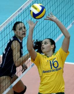 Marcelle Rodrigues right of Brazil passes the ball watched by Maria Gkaragkouni left of Greece during the first round match of Women s Volleyball World Championship Greece vs Brazil in Leipzig eastern Germany Monday Sep 2 2002 Eckehard Schulz LEIPZIG DEU