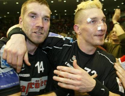 The Magdeburg handball team Steffen stiebler left and Stefan Kretzschmar right cheer after their victory in the Handball Champions League in Magdeburg on Saturday 27 April 2002 SC Magdeburg won the final return match against the Hungarian champion Fotex KC Veszprem 30 25 and is thus the first German cup winner Eckehard Schulz MAGDEBURG DEU