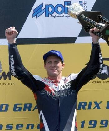 U S rider Kenny Roberts junior shows during the winner ceremony his trophy to the crowd Roberts wons the 500cc race of German motor cycling Grand Prix at the Sachsenring circuit Sunday July 18 1999 Eckehard Schulz SACHSENRING DEU