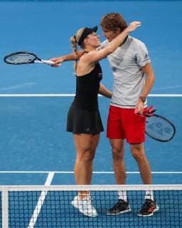 Angelique Kerber and Alexander Zverev hug after their victory Mixed Doubles Copyright: xJuergenxHasenkopfx