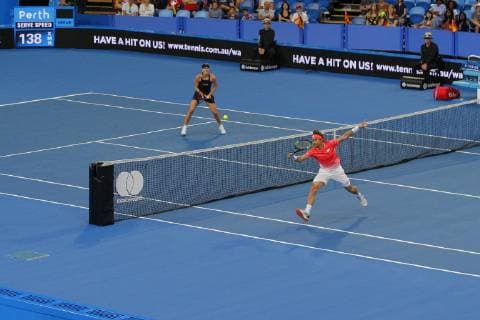 30th December 2018, RAC Arena, Perth, Australia; Hopman Cup Tennis, sponsored by Mastercard; David Ferrer of Team Spain volleys at the net as Garbine Muguruza of Team Spain watches during the mixed doubles  ActionPlus12091709 DavidxWoodley