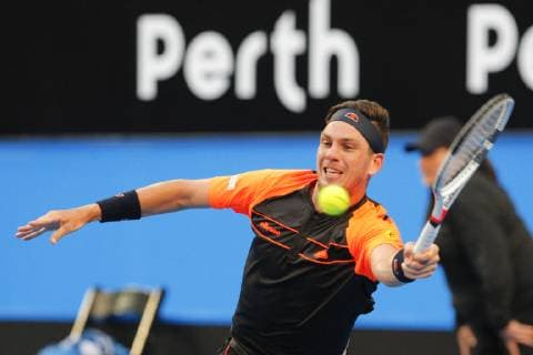 30th December 2018, RAC Arena, Perth, Australia; Hopman Cup Tennis, sponsored by Mastercard; Cameron Norrie of Team Great Britain reaches for a plays a forehand shot against Roger Federer of Team Switzerland  ActionPlus12091730 DavidxWoodley