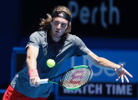 (181231) -- PERTH, Dec. 31, 2018 (Xinhua) -- Stefanos Tsitsipas of Greece returns the ball during the men s single match against Frances Tiafoe of the United States between the United States and Greece at Hopman Cup mixed teams tennis tournament in Perth, Australia, Dec. 31 , 2018. Stefanos Tsitsipas won 2-1. (Xinhua Zhou Dan) (SP)AUSTRALIA-PERTH-TENNIS-HOPMAN CUP 