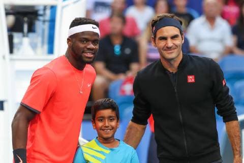 Roger Federer and Frances Tiafoe pose on net Tennis Hopman Cup New Year™s Eve Gala ITF Crown Perth Grand Ballroom Perth Western Australia Australia 1 January 2019 Â Copyright: xJuergenxHasenkopfx