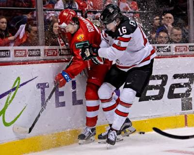 (190101) -- VANCOUVER, Jan. 1, 2019 -- Russia s Alexander Romanov (L) and Canada s MacKenzie Entwistle compete at the 2019 IIHF World Junior Championship in Vancouver, Dec. 31, 2018. Russia won 2-1. ) (SP)CANADA-VANCOUVER-IIHF-WORLD JUNIOR CHAMPIONSHIP AndrewxSoong 