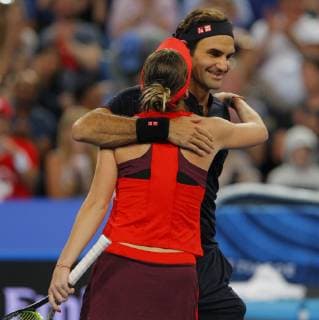 1st January 2019, RAC Arena, Perth, Australia; Hopman Cup Tennis, sponsored by Mastercard; Roger Federer and Belinda Bencic of Team Switzerland hug after defeating the USA 2 sets to Love  ActionPlus12092031 DavidxWoodley