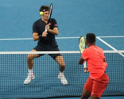Roger Federer is hit by a Frances Tiafoe ball Mixed Double Copyright: xJuergenxHasenkopfx