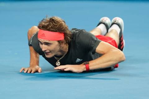 Alexander Zverev slips and falls to the ground Copyright: xJuergenxHasenkopfx