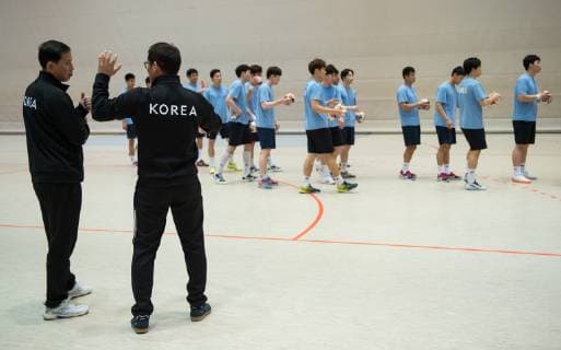 Coach Myong Chol Sin and head coach Young Shin Cho l r are on the field Handball Public training of the joint handball team from North and South Korea in preparation for the Handball World Championship 2019 in DEN GER at the Horst Kober Sports Center in Berlin Germany on 04 01 2019