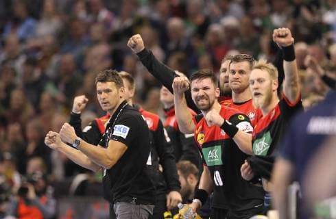 Photo national coach Christian Prokop and cheering players right Böhm and Wiede Germany handball international on So 06 01 2019 in Kiel Germany Argentina