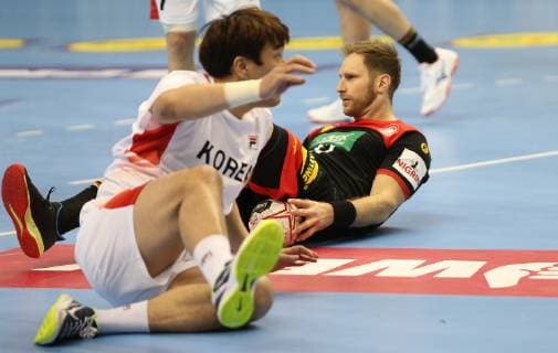 Steffen Weinhold Germany vs. KIM Dongmyung Korea at the opening match Korea vs. Germany of the Mens Handball World Championship 2019 on 10 01 2019 in the Mercedes Benz Arena in Berlin Handball World Championship 2019 Group A Korea vs. Germany