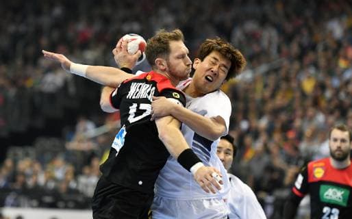 Steffen Weinhold Germany in duel with Dongmyung Kim Korea Korea Germany Korea IHF Handball World Championship 2019 Hanball World Championship 2019 Men Men Men Men Handball Germany Germany preliminary round Group A group A Berlin 10 1 2019