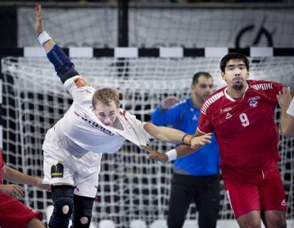 Rene Toft Hansen of Denmark and Cristian Moll of Chile during the men s IHF Handball World Championship match in Group C between Denmark Chile in Copenhagen Denmark on Thursday Jan 10 2019 Copenhagen Denmark, detectedSourceLanguage  Copyright: Scanpix LiselottexSabroex COP101 spdk20190110-222707-L