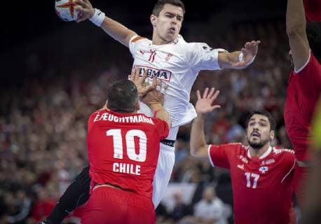 Rasmus Lauge of Denmark and Julio Baumann of Chile during the men s IHF Handball World Championship match in Group C between Denmark Chile in Copenhagen Denmark on Thursday Jan 10 2019 Copenhagen Denmark, detectedSourceLanguage  Copyright: Scanpix LiselottexSabroex COP101 spdk20190110-224349-L