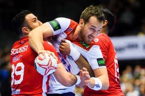 190111 Mohamed Soussi of Tunisia and Christian O Sullivan of Norway during the 2019 IHF World Championship match between Tunisia and Norway on January 11 2019 in Herning Photo Jon Olav Nesvold BILDBYR u0081N kod JE 160394, detectedSourceLanguage  Copyright: JONxOLAVxNESVOLD BB190111JE110