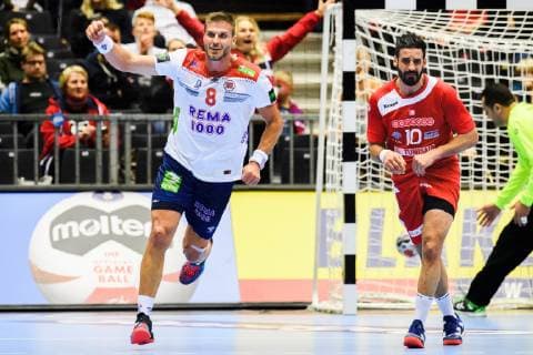 190111 Bjarte Myrhol of Norway celebrates while Kamel Alouini of Tunisia looks dejected during the 2019 IHF World Championship match between Tunisia and Norway on January 11 2019 in Herning Photo Jon Olav Nesvold BILDBYR u0081N kod JE 160394, detectedSourceLanguage  Copyright: JONxOLAVxNESVOLD BB190111JE148