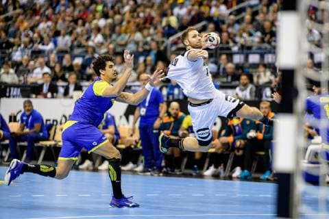 Germany vs Brazil Handball World Championship 2019 12 01 2019 Steffen Weinhold GER 17 with a goal with Jose Toledo BRA 10 at the match between Germany and Brazil at the Handball World Championship in Berlin on 12 01 2019 Berlin BER Germany Mercedes Benz Arena