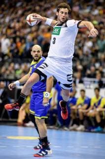 Germany vs Brazil Handball World Championship 2019 12 01 2019 Uwe Gensheimer GER 3 scoring with Gustavo Rodrigues BRA 95 at the match between Germany and Brazil at the Handball World Championship in Berlin on 12 01 2019 Berlin BER Germany Mercedes Benz Arena