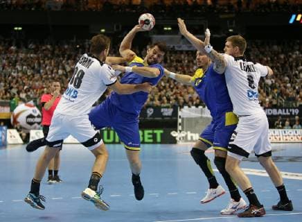 12 01 2019 Handball IHF World Championship Denmark and Germany 2019 preliminary round Group A Germany Brazil in the Mercedes Benz Arena Berlin L R Fabian Böhm Germany against Raul Nantes Brazil Alexandro Pozzer Brazil Tim Suton Germany