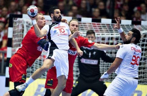 Kamel Alouni of Tunisia is being held by Henrik Moellgaard of Denmark during the men s IHF Handball World Championship Group C match between Denmark and Tunisia in Herning Denmark Saturday Jan 12 2019 Herning Jylland Denmark, detectedSourceLanguage  Copyright: HenningxBagger HenningxBaggerx COP101 spdk20190112-222004-L