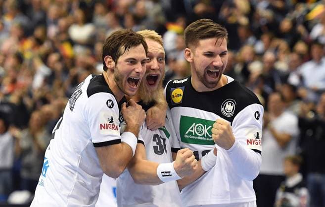 Uwe Gensheimer Germany Matthias Musche Germany and Fabian Wiede Germany with a group cheer after the match Germany Brazil Germany Brasilia France IHF Handball World Championship 2019 Hanball World Championship 2019 Men Men Men Handball Germany Germany Germany preliminary round Group A group A Berlin 12 1 2019