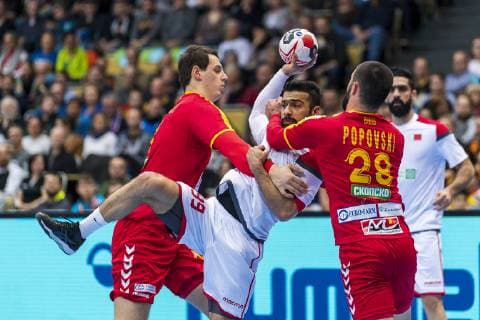 Munich Germany 13 January 2019 World Cup 2019 Men Group B Macedonia vs Bahrain v left in duel Filip Taleski Macedonia Rhine Neckar Loewen Husain Alsayyad Bahrain Martin Popovski Macedonia Munich Olympic Hall Bayern Germany