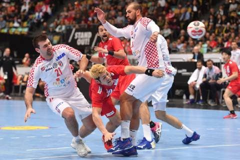 Shinnosule TOKUDA JPN action duel litter againstZeljko MUSA VCRO re and Alen BLAZEVIC CRO li preliminary round group B Croatia CRO Japan JPN on 13 01 2019 in Munich Germany Olympic Hall Handball World Championship 2019 from 10 01 27 01 2019 in Germany and Denmark