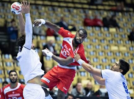 Mosbah Sanai of Tunisia is stopped by Javier Frelijj of Chile during the men s IHF Handball World Championship Group C match between Tunisia and Chile in Herning Denmark on Monday Jan 14 2019 Herning Jylland, detectedSourceLanguage  Copyright: HenningxBagger HenningxBaggerx COP109 spdk20190114-154525-L