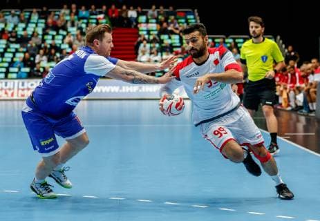 Munich Germany 14 01 2019 IHF Handball WM 2019 Group B Island Bahrain Arnor por Gunnarsson ISL and Husain Alsyyad BHR in the duel DeFodi048